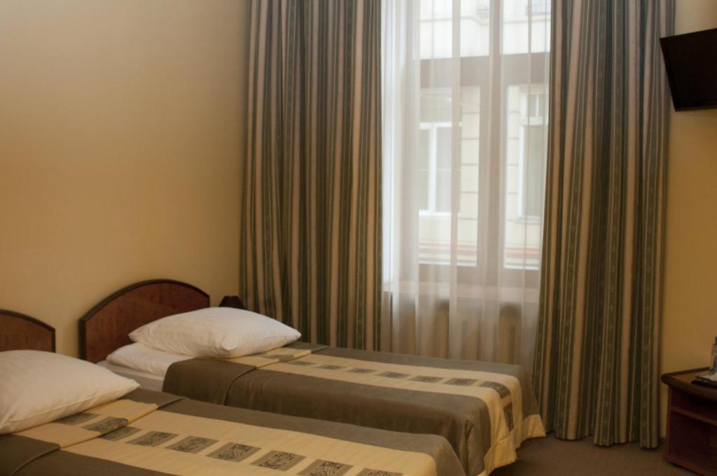 Wien Hotel Lviv Chambre photo